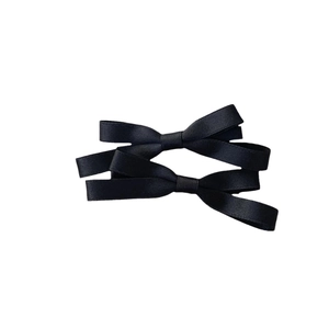 Pair of cute black satin bow hair clips for women with classic woven ribbon texture