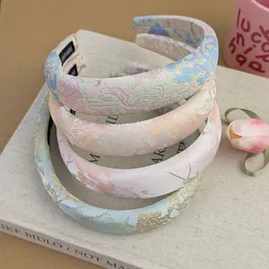 Set of four jacquard satin padded headbands in soft pastel floral patterns