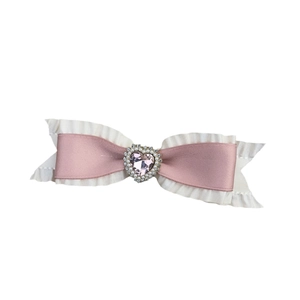 Pink and cream satin bow hair clip featuring a large heart gemstone with pearl accents