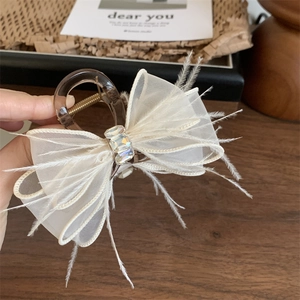 Elegante pinza per capelli ambra con fiocco di pizzo, piume e cristallo centrale