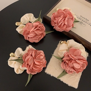 Set of 4 vintage satin rose flower scrunchies with elegant gold bead detail and green leaves