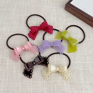 6-piece set of candy-colored bow hair ties with hollow design on light checkered cloth
