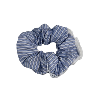 Blue and white striped scrunchie with white lace trim for hair styling