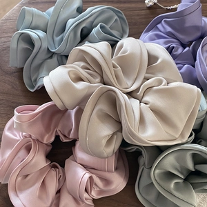 Elegant Morandi silk satin scrunchies set in blue, pink, and green for hair styling