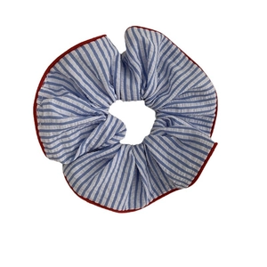 Navy blue and white striped cotton scrunchie with red contrast piping on plain background