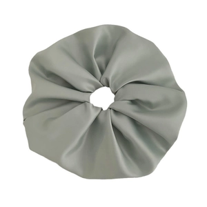 Elegant silk satin scrunchie in mint green with elastic design for high ponytail