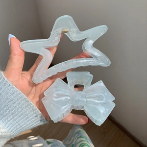 Translucent mint blue star and bow hair claws set with iridescent pearly finish