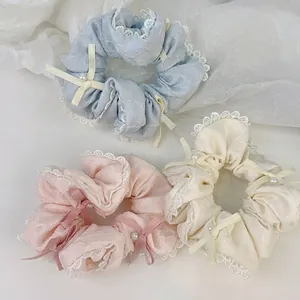 Set di tre elastici per capelli in pizzo coreano con perle e fiocchi color pastello