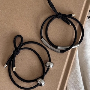 Minimalist black elastic hair ties with silver metal tubes and beads in a two-piece set