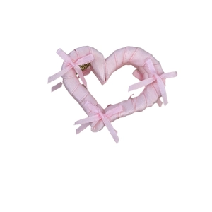 Pink heart-shaped hair claw clip with satin bows and fabric wrap for balletcore styling