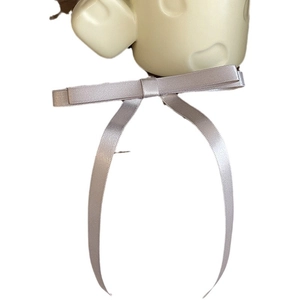 Elegant silver grey satin ribbon bow hair clip with a smooth glossy finish for women