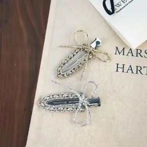 Barrettes à cheveux élégantes en métal avec nœud, finitions or champagne et argent