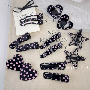 Pink polka dot metal hair clip set for women with heart and star shapes in black and pink