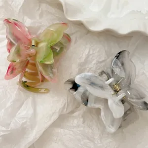 Elegant 3D butterfly hair claws set in pink green and black white marble acetate finish