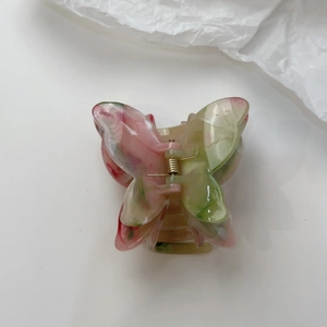 Elegant 3D butterfly hair claw clip with pink and green marble pattern for women