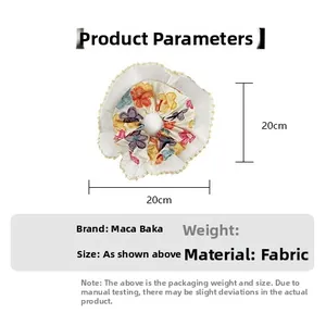Floral scrunchie with lace trim detail showing 20cm size specifications and fabric texture