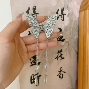 Silver butterfly hair claw clip with long metallic tassels and sparkling crystal rhinestones