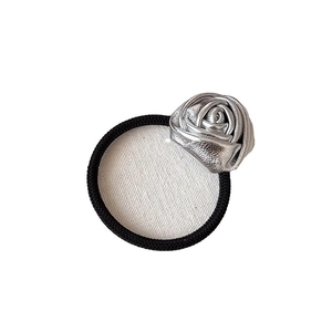 Elastic black hair tie featuring a metallic silver rose charm for women ponytail