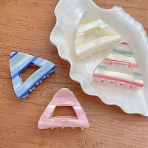 Minimalist triangle acetate hair claw clips with striped patterns in various colors