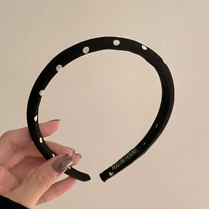 Handmade black polka dot satin headband with sponge padding for vintage styling