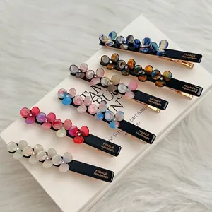 Elegant floral hair clips with acetate flowers and rhinestones in six colors