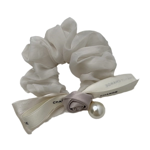 Elegant organza scrunchie with lavender satin rose, pearl charm, and printed ribbon