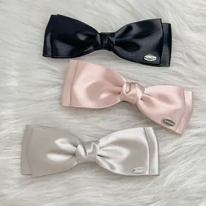 Elegant French style double-layered satin bow hair clips in black, pink and champagne