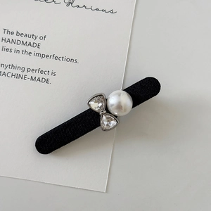French black ribbon hair clip with a large pearl and sparkling rhinestone bow detail