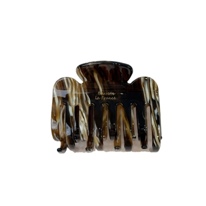 French retro acetate hair claw with brown tortoiseshell pattern and golden Barrette lettering