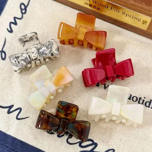 Set of 6 colorful acetate bow hair clips in vibrant colors and pearl patterns