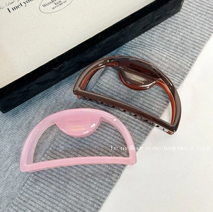 Elegant semi-round acetate hair claws in tortoise shell and pink with gold France logo