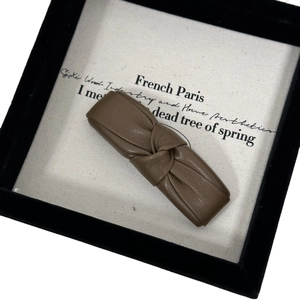 Vintage brown PU leather knotted hair clip for women with elegant minimalist design