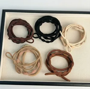 Five-pack of elastic ribbed hair ties in earthy tones like brown and beige for high ponytails