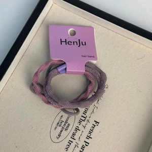 Set of high elasticity purple fabric hair bands for ponytails in elegant display tray