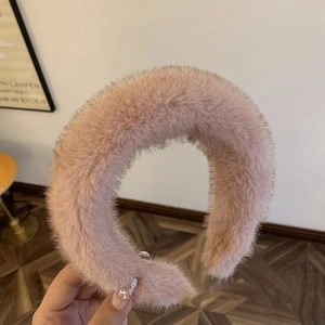 Pink faux fur headband with thick plush texture for high cranial top hair styling