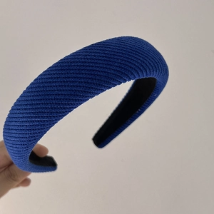 Detail of navy blue twill knit headband with thick sponge padding and non-slip lining