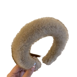Thick plush winter headband in brown faux fur material for high cranial top hair styling