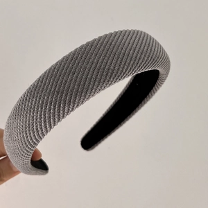 Detail showing grey ribbed twill fabric texture and black anti-slip lining of the headband