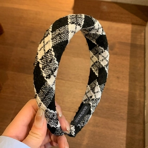 Classic black and white checkered plaid headband in wool fabric with a handmade label