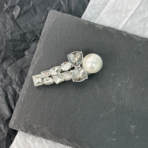 Elegant silver hair clip with large white pearl and multifaceted sparkling rhinestones