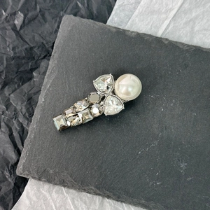 Elegant silver hair clip with large white pearl and faceted grey crystal rhinestones