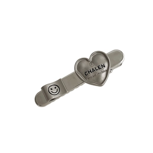 Pince à cheveux en métal argenté brossé avec détail cœur et motif de smiley
