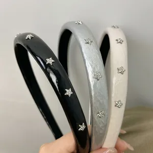 Star-studded leather headbands in black, silver, and cream for a chic, trendy hair style