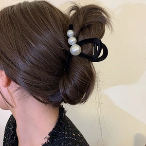 Elegant black velvet claw clip with faux pearls for French vintage hairstyle