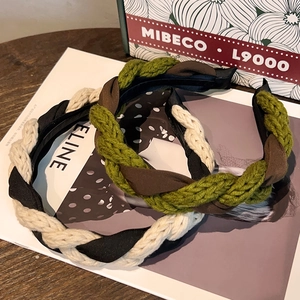 Vintage green knit braided headband with elegant French twist design for autumn and winter