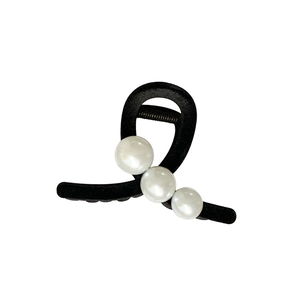 Elegant black velvet hair claw clip with three white pearls in a French vintage style