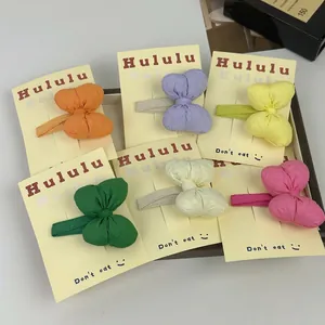 Set di fermagli per capelli a fiocco in colori macaron su carta per bambine