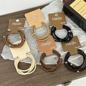 Lot de 5 chouchous haute élasticité avec perles dorées aux tons terre sur emballage chic