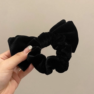 Elegant black velvet bow hair scrunchie with thick texture and high elasticity