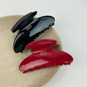 Elegant large acetic acid shark hair clips in black and deep red with gold lettering